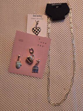 A new day charms and gold plated 24" chain to create your own charm necklace